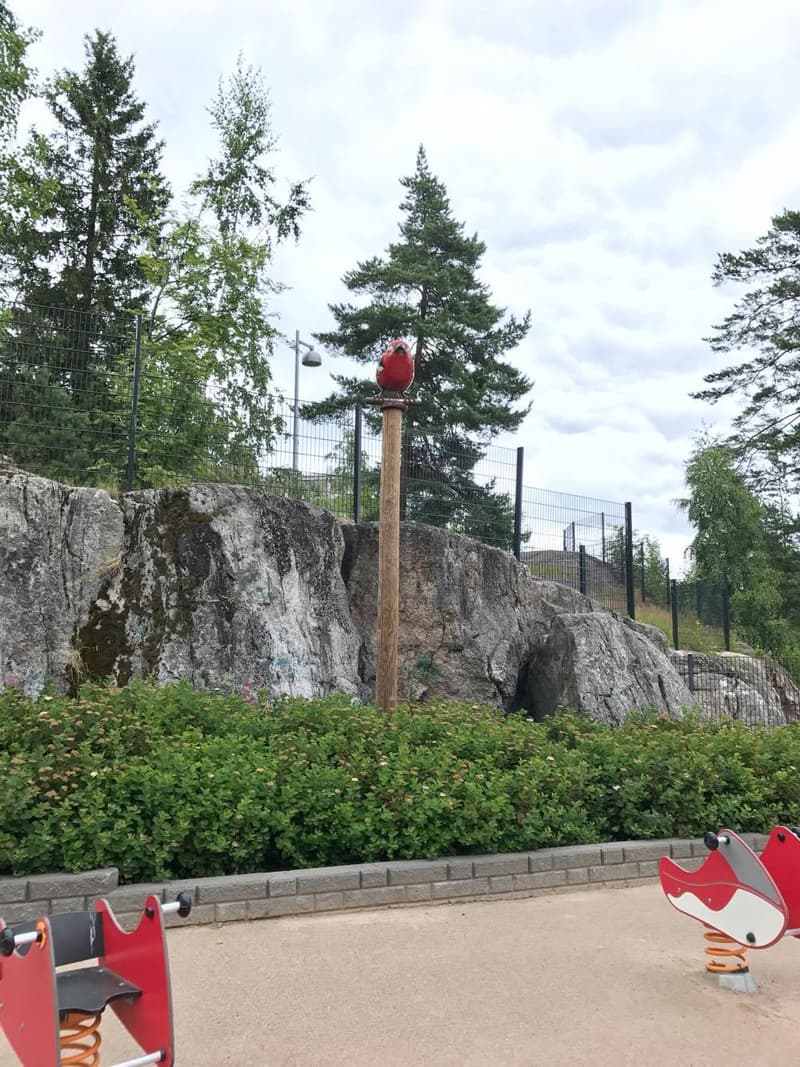 The yard at Myllynsiipi Playground is bordered by rock.